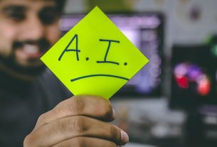 person holding green paper